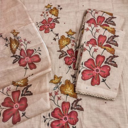 A beautiful linen fabric set featuring vibrant floral patterns in shades of red, yellow, and brown, with intricate detailing and lace trim.